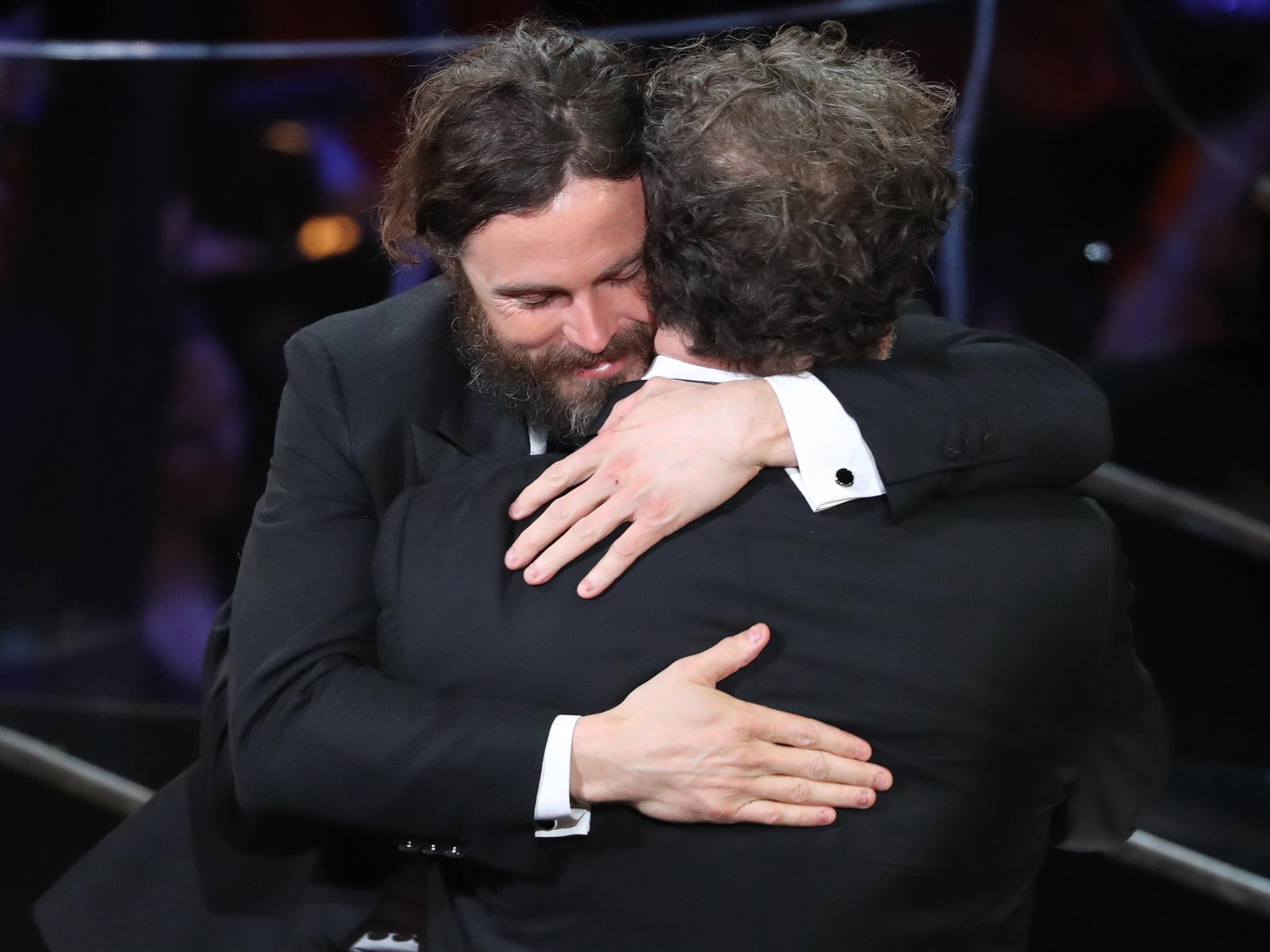 Casey Affleck hugs winner of Best Original Screenplay Kenneth Lonergan for ‘Manchester by the Sea’