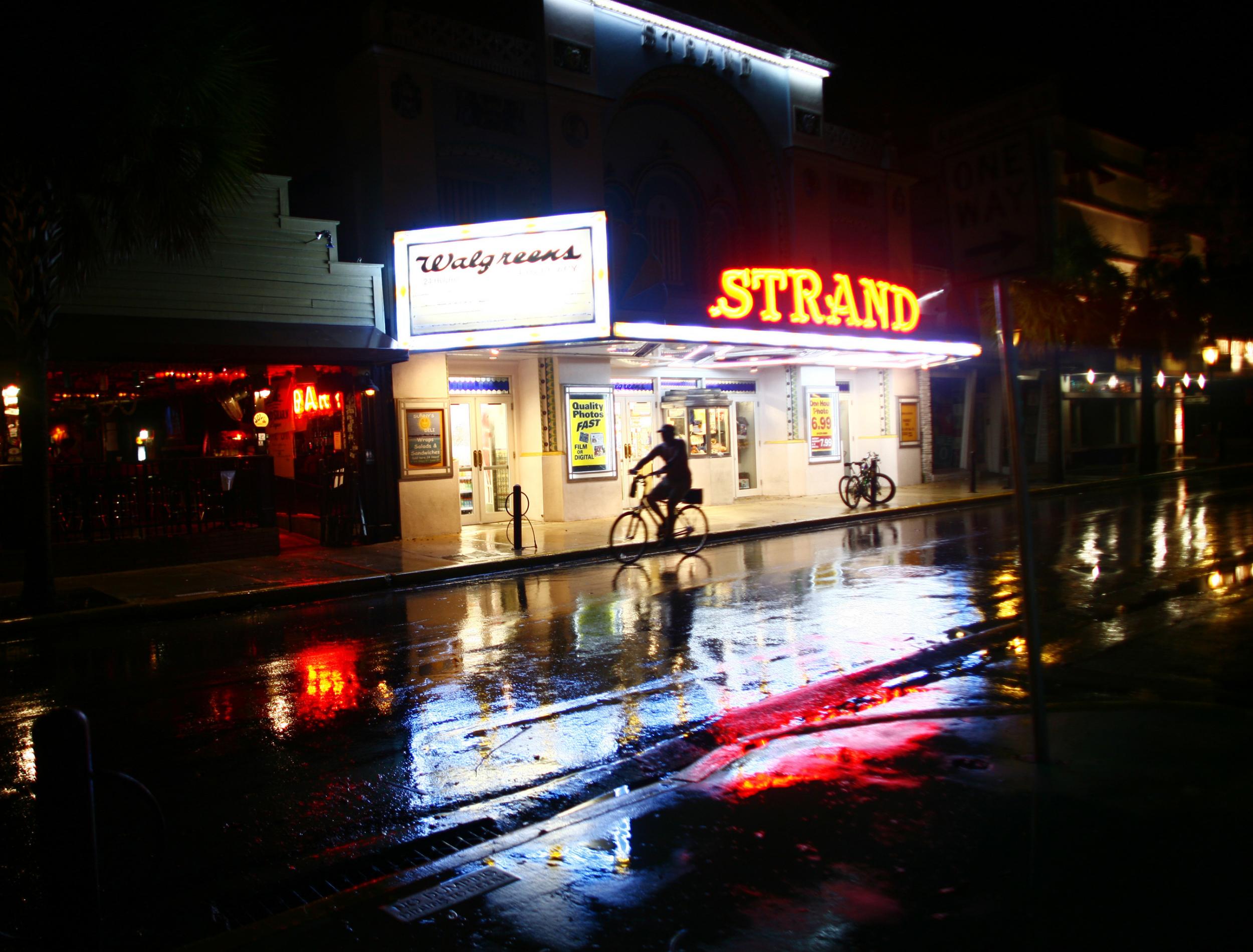 A man rides a bike along Duval Street in Key West, Florida. A gay couple were assaulted in a suspected hate crime on this street last week