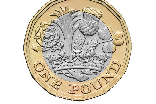 The new £1 coin featuring a rose, leek, thistle and shamrock emerging from a Royal Coronet, based on a design by 15-year-old David Pearce from Walsall