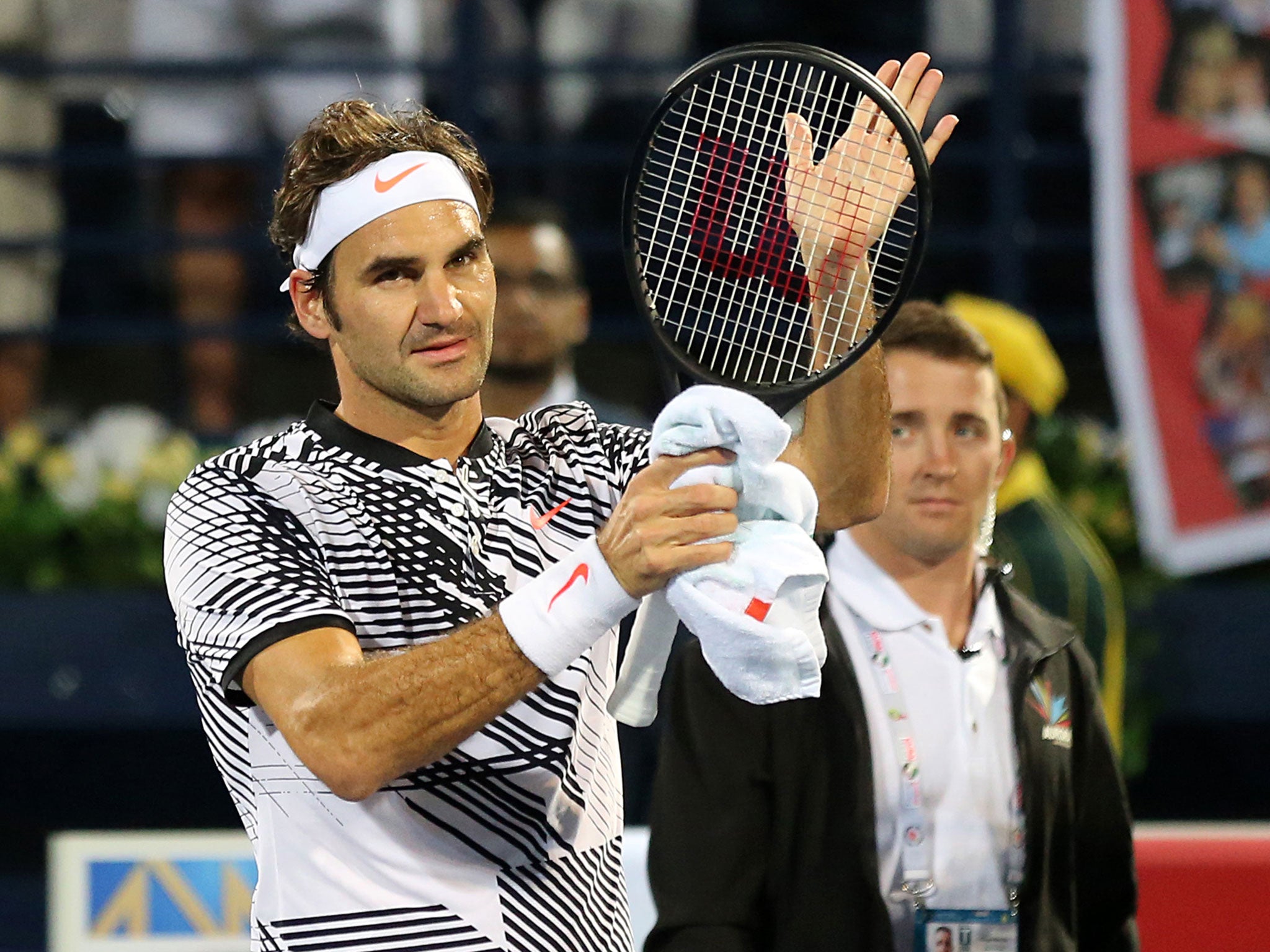 Roger Federer salutes the crowd after his Dubai Championship victory over Benoit Paire
