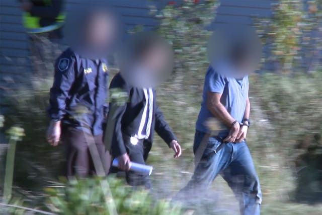 Haisem Zahab, 42, being arrested by counter-terror police at his home in Young, Australia, on 28 February