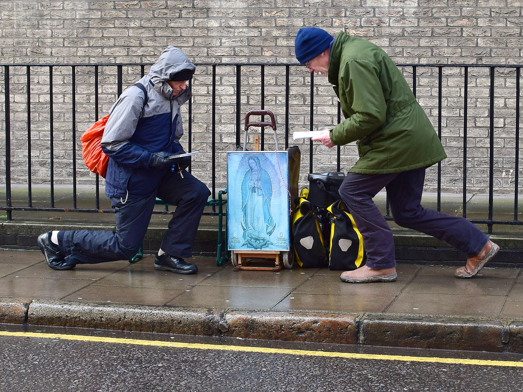 Pro-life campaigngers pray outside at an abortion clinic in London