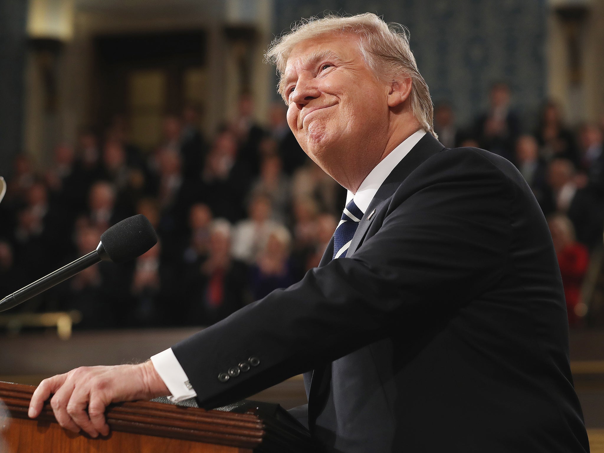 President Donald Trump arrives to deliver his first address to a joint session of Congress