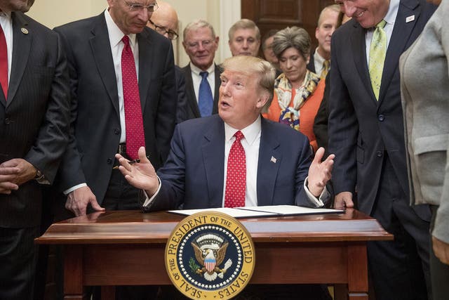 President Donald Trump speaks as he signs an order withdrawing the Waters of the United States (WOTUS) rule, 28 February 2017