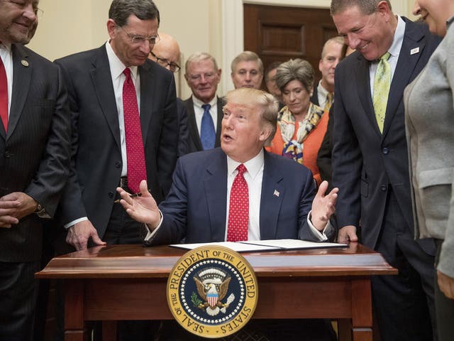 President Donald Trump speaks as he signs an order withdrawing the Waters of the United States (WOTUS) rule, 28 February 2017