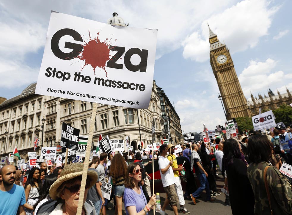 Demonstrators march through the streets from outside the Israeli embassy in central London, calling for an end to violence in Gaza