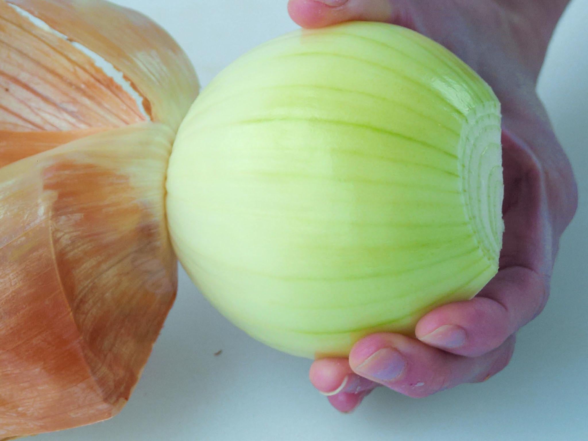 3. Peel each onion half and discard the skin. It is also a good idea to remove the first of the inner pale leaves of the onion as these tend to be leathery and do not break down during cooking