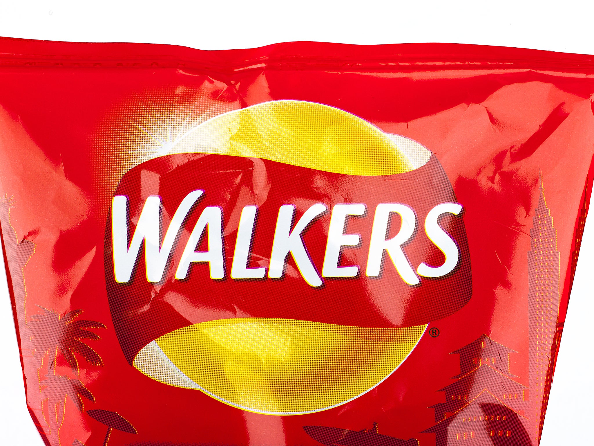 A close-up of the Walkers logo on a Ready Salted packet of crisps