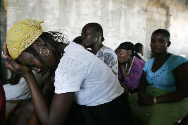 A woman waits for the result of her pregnancy test in an clinic in Haiti