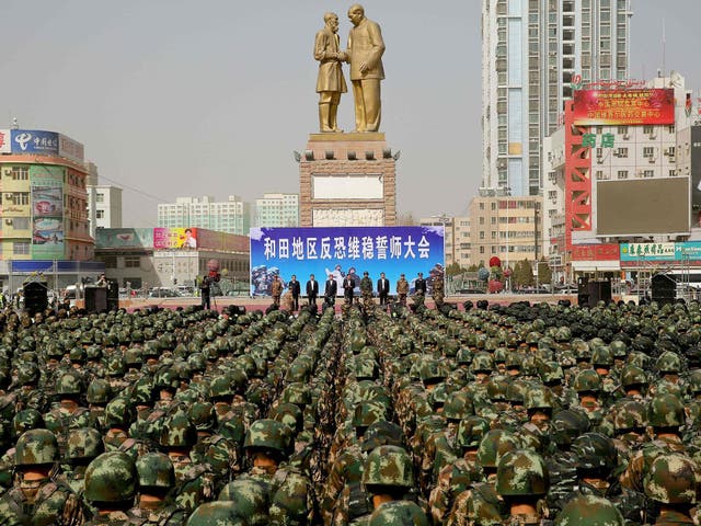 Chinese military police attending an anti-terrorist oath-taking rally in Hetian, northwest China's Xinjiang Uighur Autonomous Region