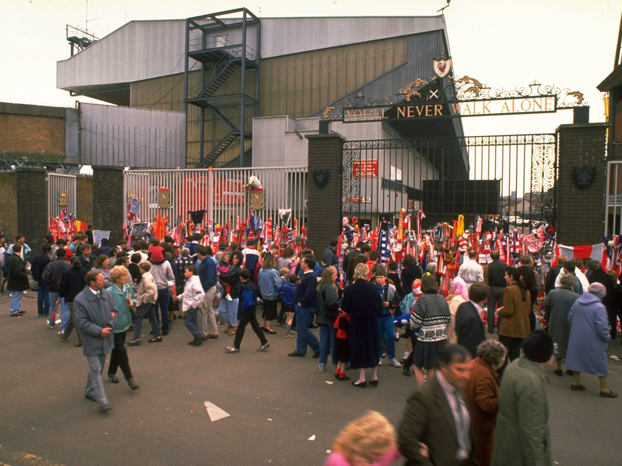 Supporters pay their respects after the Hillsborough disaster