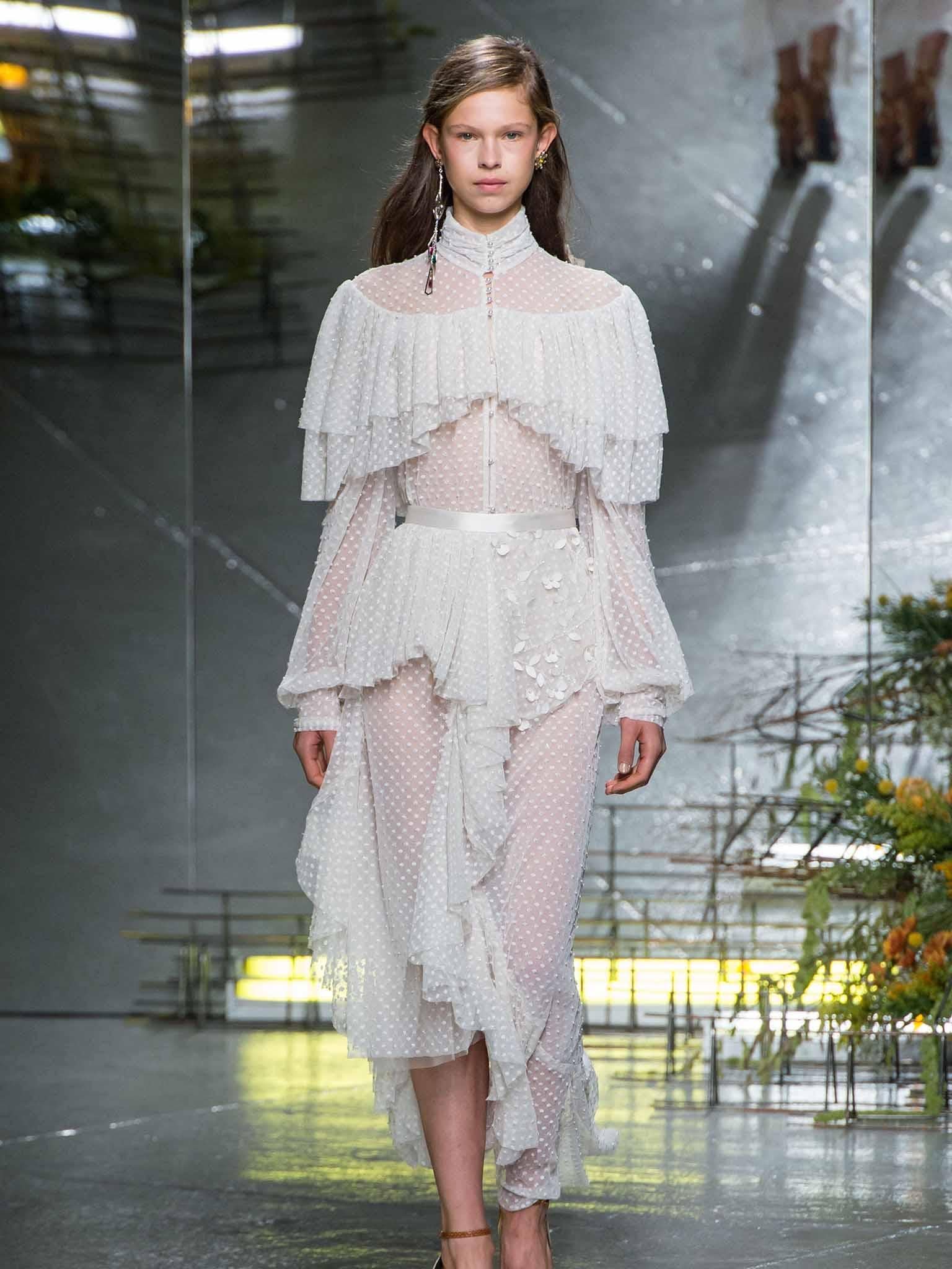 At Rodarte, the white dress was adorned with Victoriana frills and layers of lace