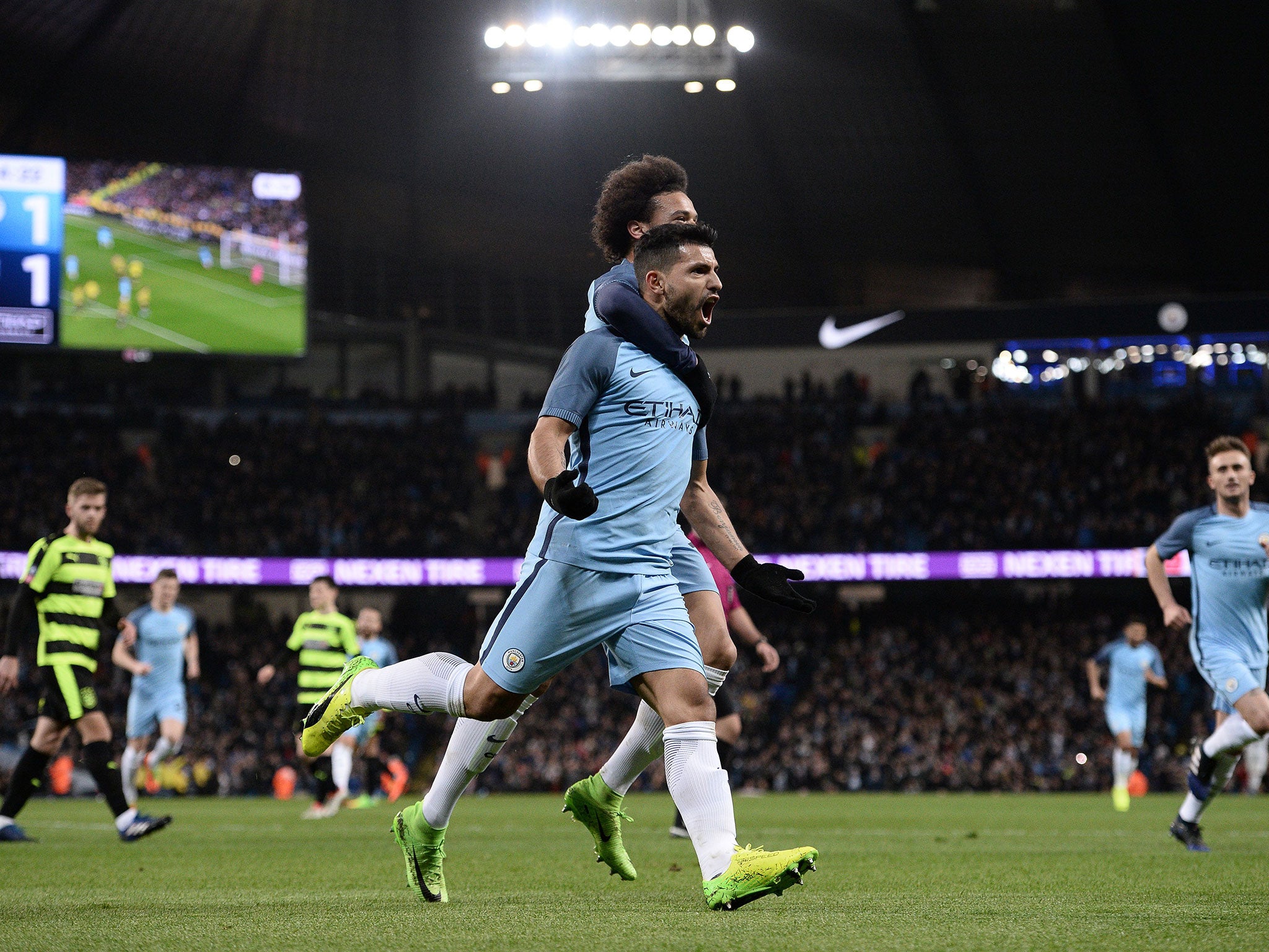 Sergio Aguero celebrates with Leroy Sane after scoring City's second