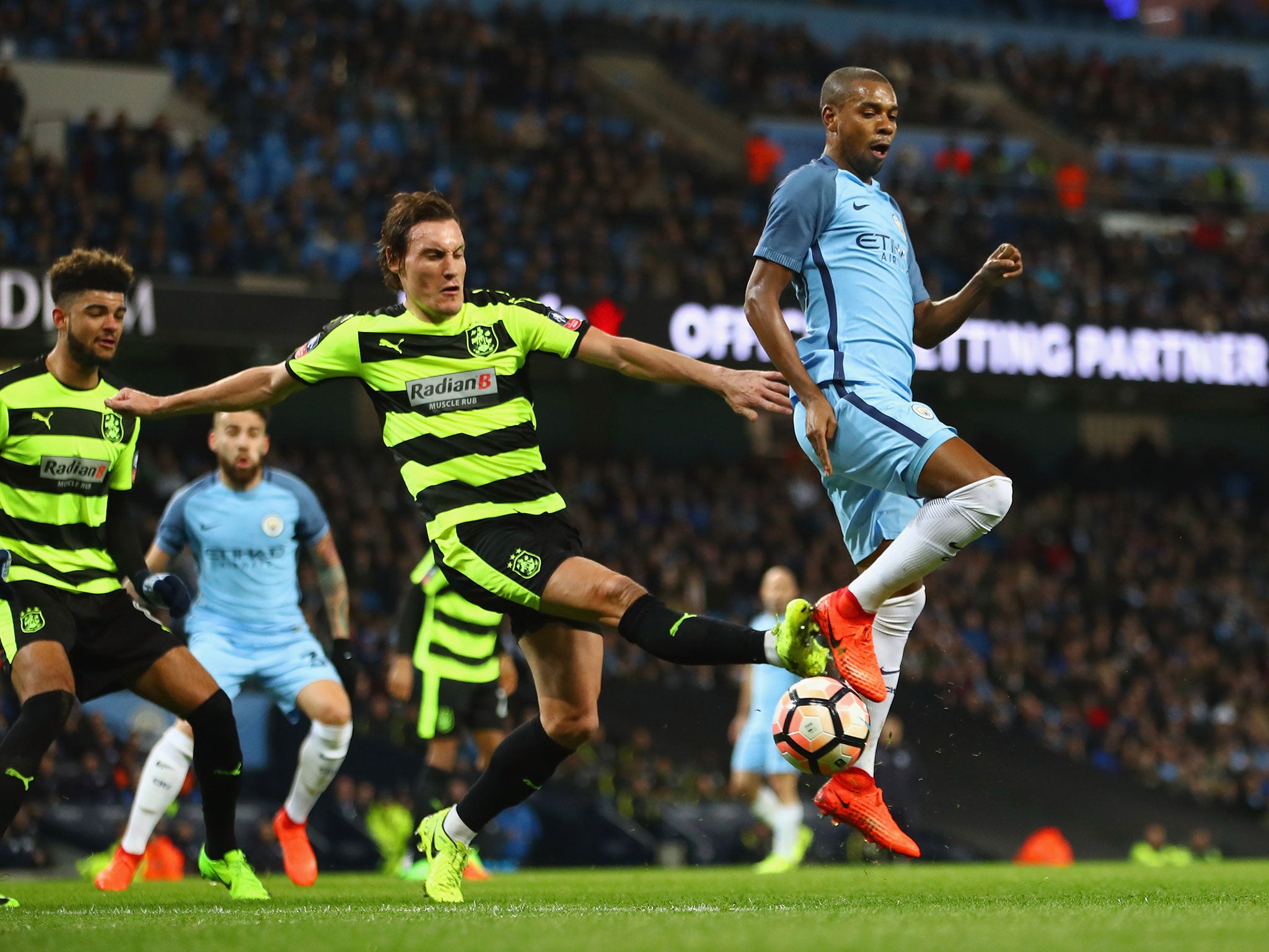 Fernandinho tries to flick the ball past Dean Whitehead