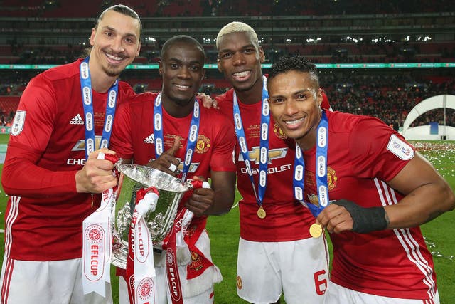 Antonio Valencia (right) believes Manchester United can add the FA Cup and Europa League trophies