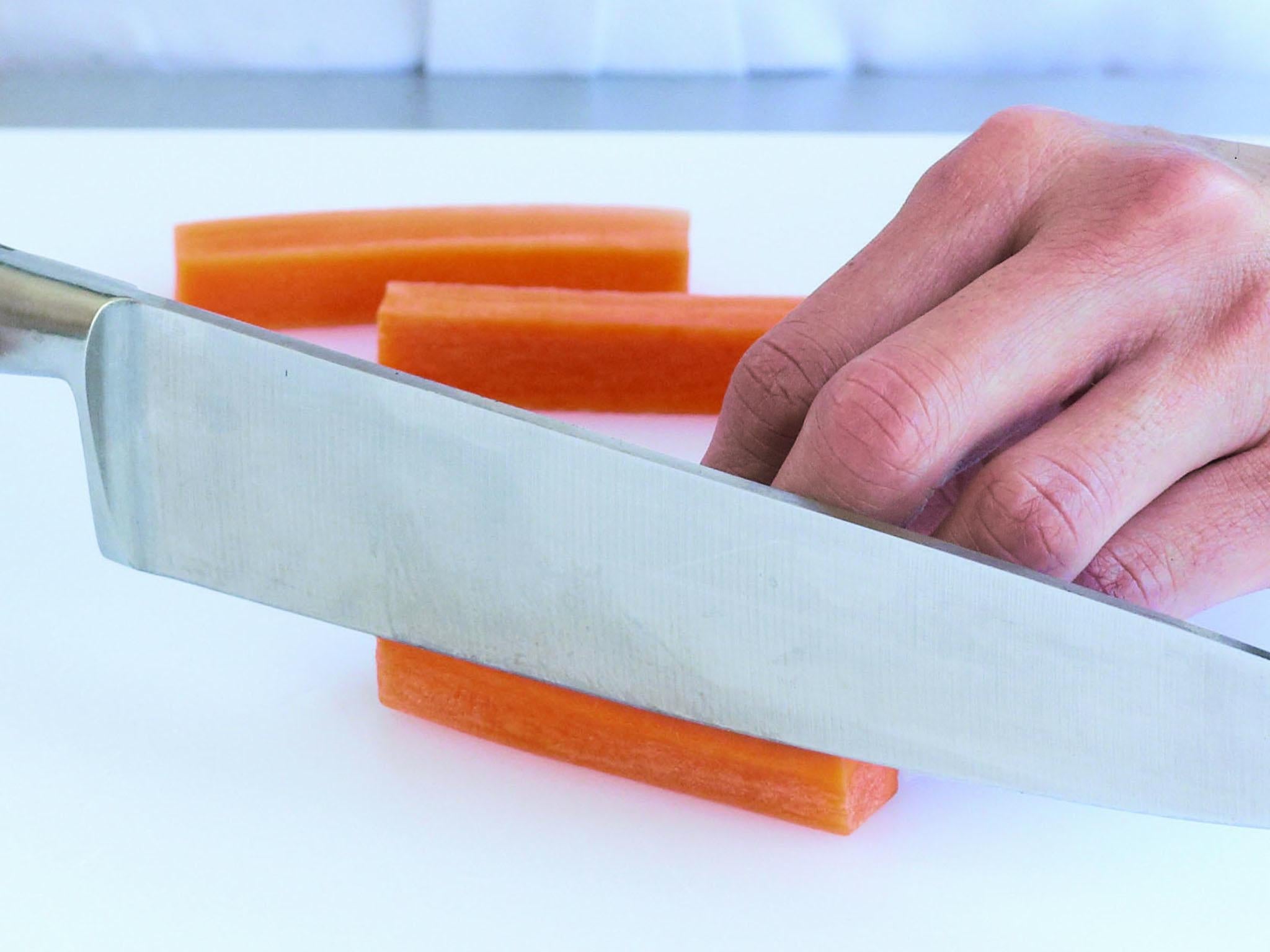 Cut the blocked carrot into batons or sticks, 5–6.5cm long and approximately 1cm square. For smaller batons, or allumettes, cut each large baton lengthways into 4 thinner sticks, about 5mm square