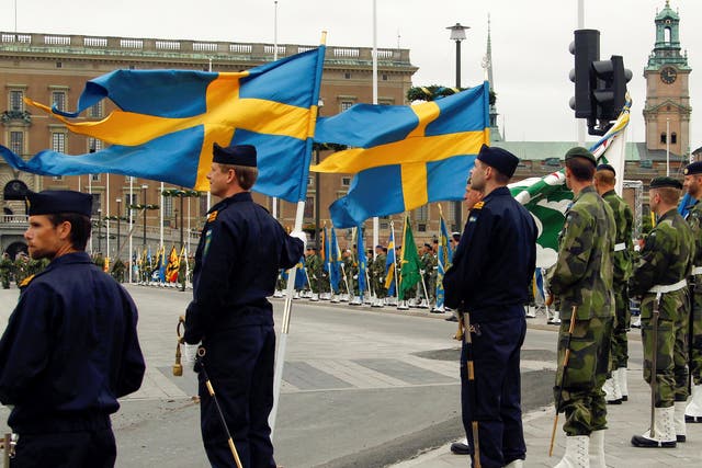 Swedish armed forces soldiers attend a rehearsal in front of the Royal Palace in Stockholm