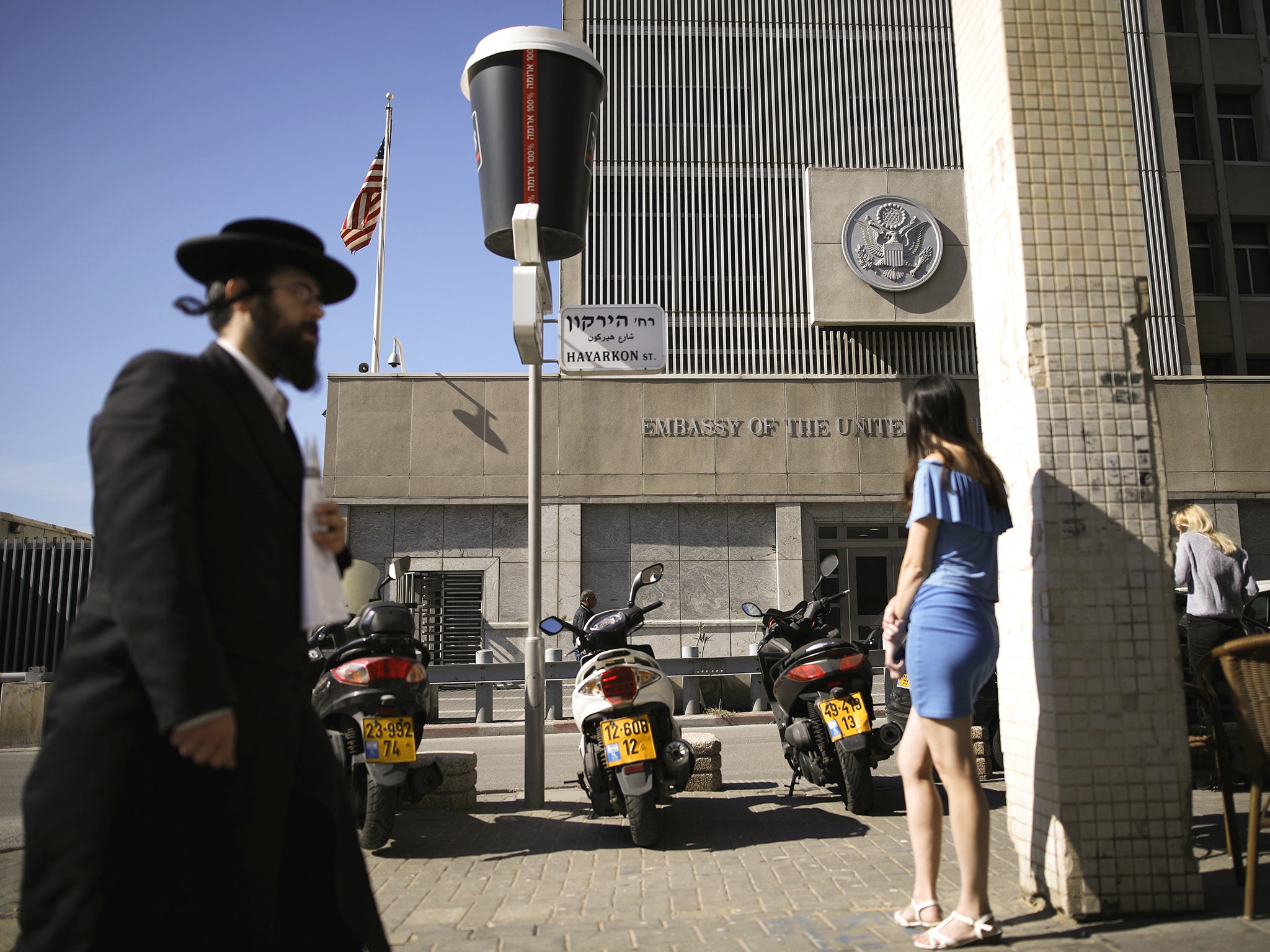 An ultra-Orthodox Jewish man walks by the US embassy in Tel Aviv, Israel