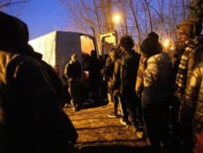 Charities vow to keep giving food to Calais refugees despite ban
