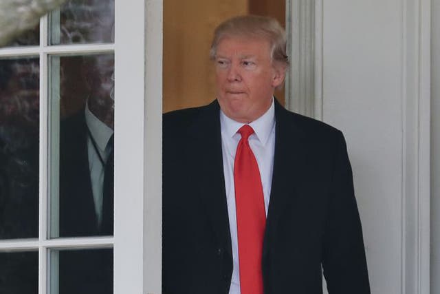 President Donald Trump exits the Oval Office of the White House in Washington