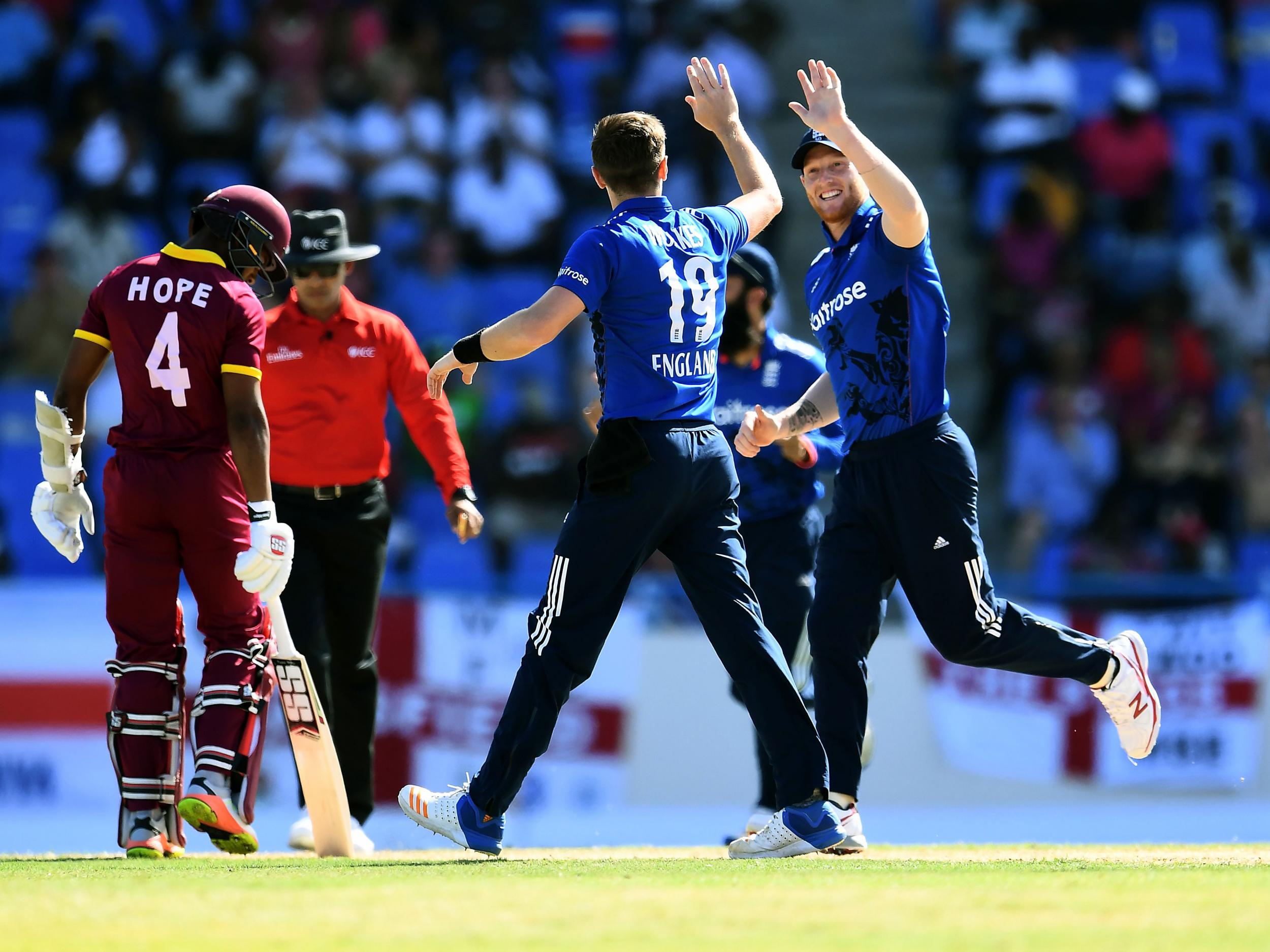 &#13;
Woakes is congratulated by Stokes after yet another wicket &#13;