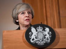 Stop tax cuts to save the NHS, Theresa May warned