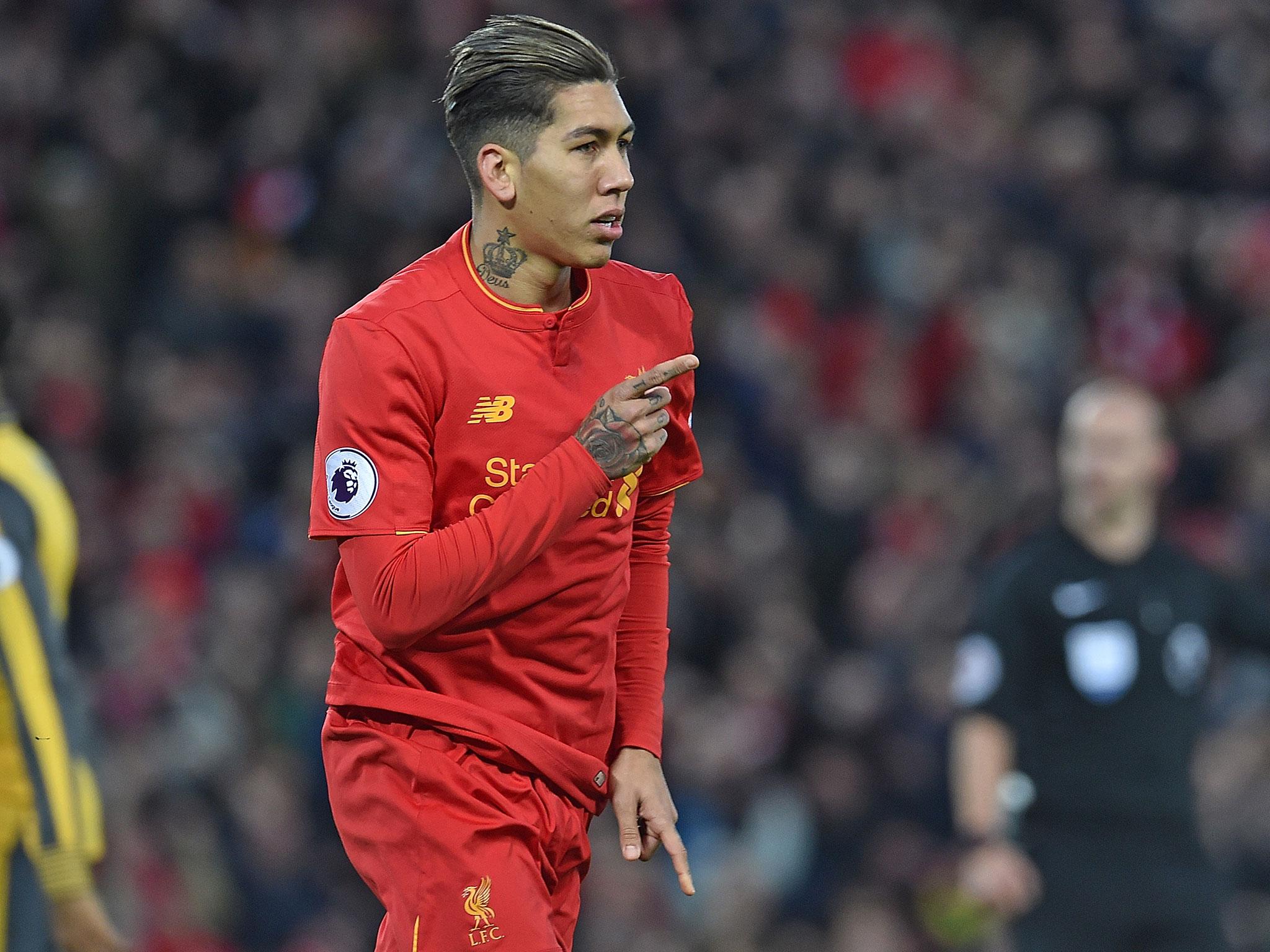 Roberto Firmino celebrates after scoring Liverpool's opening goal against Arsenal