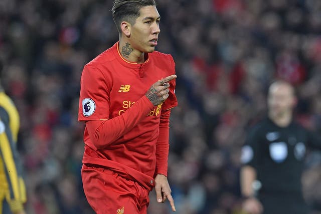 Roberto Firmino celebrates after scoring Liverpool's opening goal against Arsenal