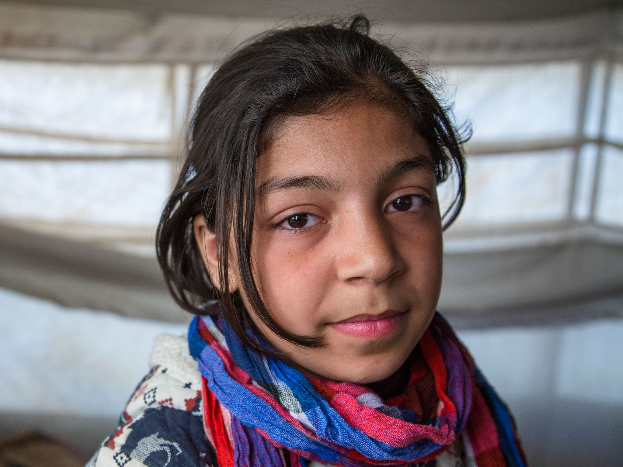 Zainab, 11, from Deir Ezzor, in her family's tent in Syria's al-Hol refugee camp