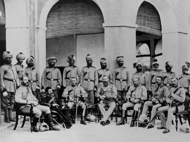 A group of British Frontier infantry soldiers with Indian soldiers lined up behind circa 1880