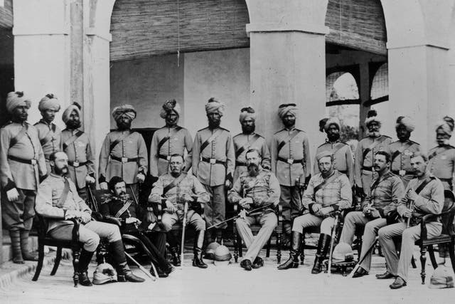 A group of British Frontier infantry soldiers with Indian soldiers lined up behind circa 1880