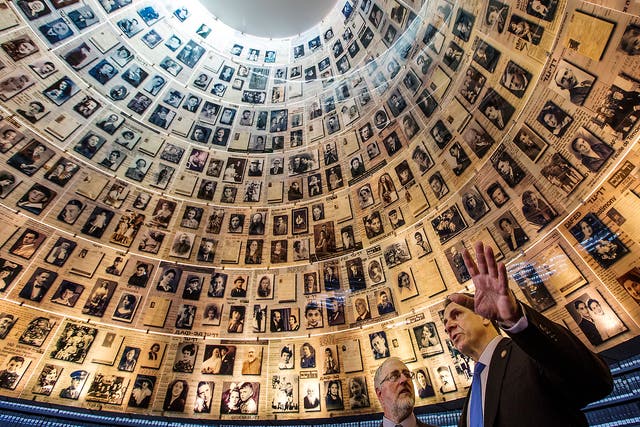 New York Governor Mario Cuomo looks around the 'Hall of Names' in the Yad Vashem Holocaust Memorial in Jerusalem.  The hall has portraits of some 600 individuals exterminated by the Nazis during the Holocaust of World War II