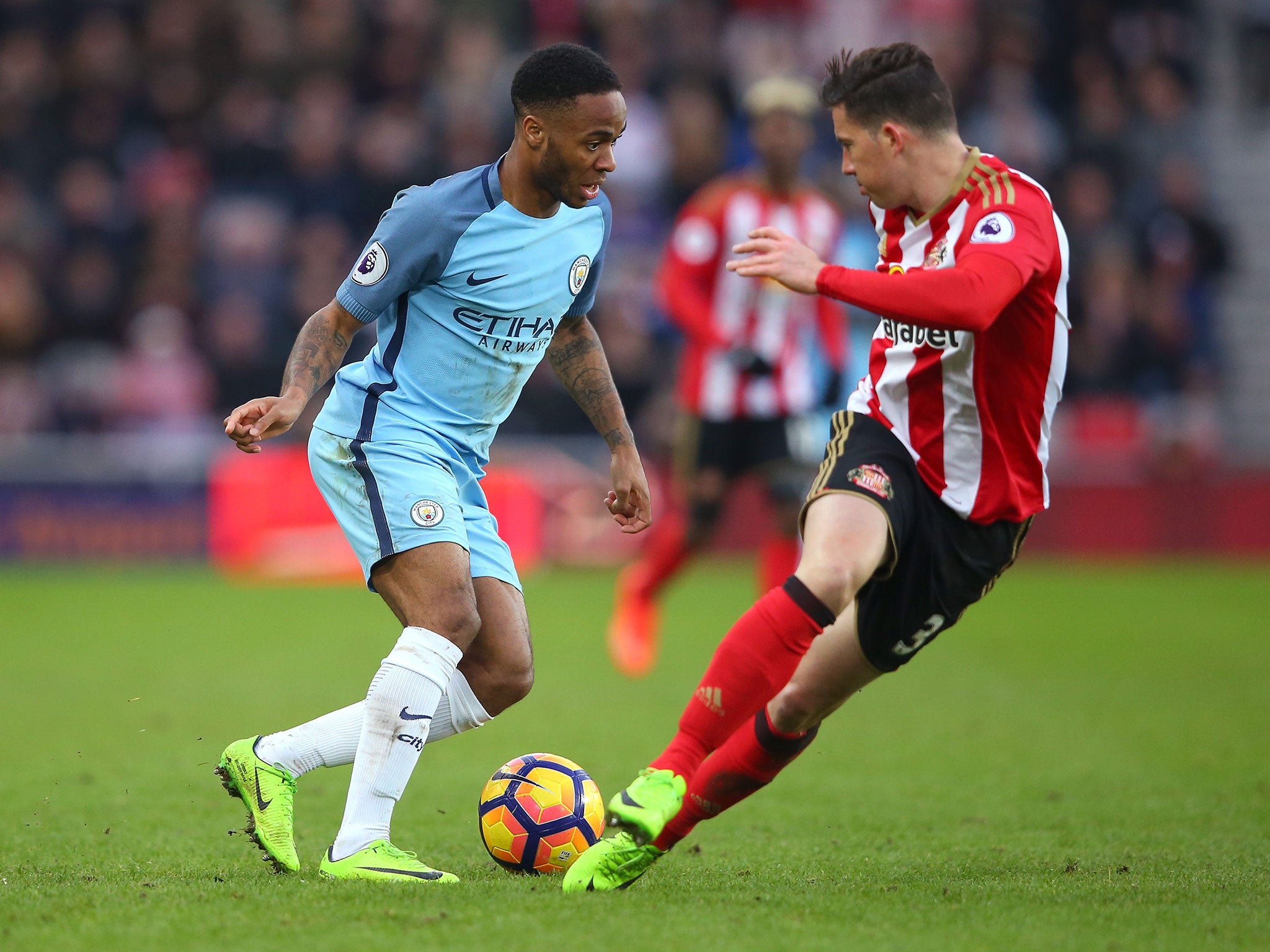 Raheem Sterling looks to take on Bryan Oviedo