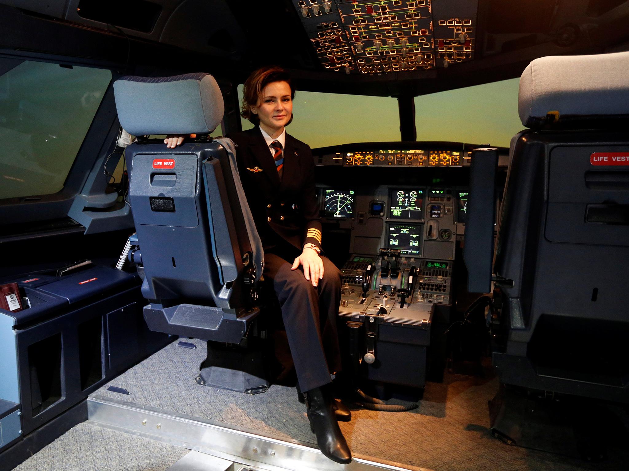Pilot Maria Uvarovskaya poses for a photograph in the A320 flight simulator at the Aeroflot training centre at Sheremetyevo airport. "Much more can be done by the women themselves to solve such problems (gender inequality)," said Uvarovskaya.