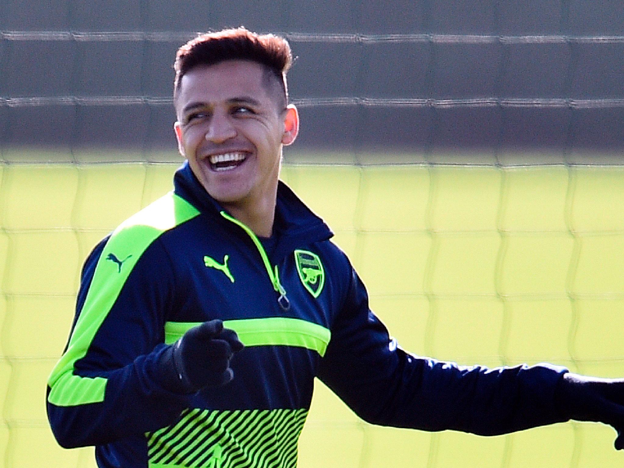 Alexis Sanchez was all smiles at Arsenal training on Monday