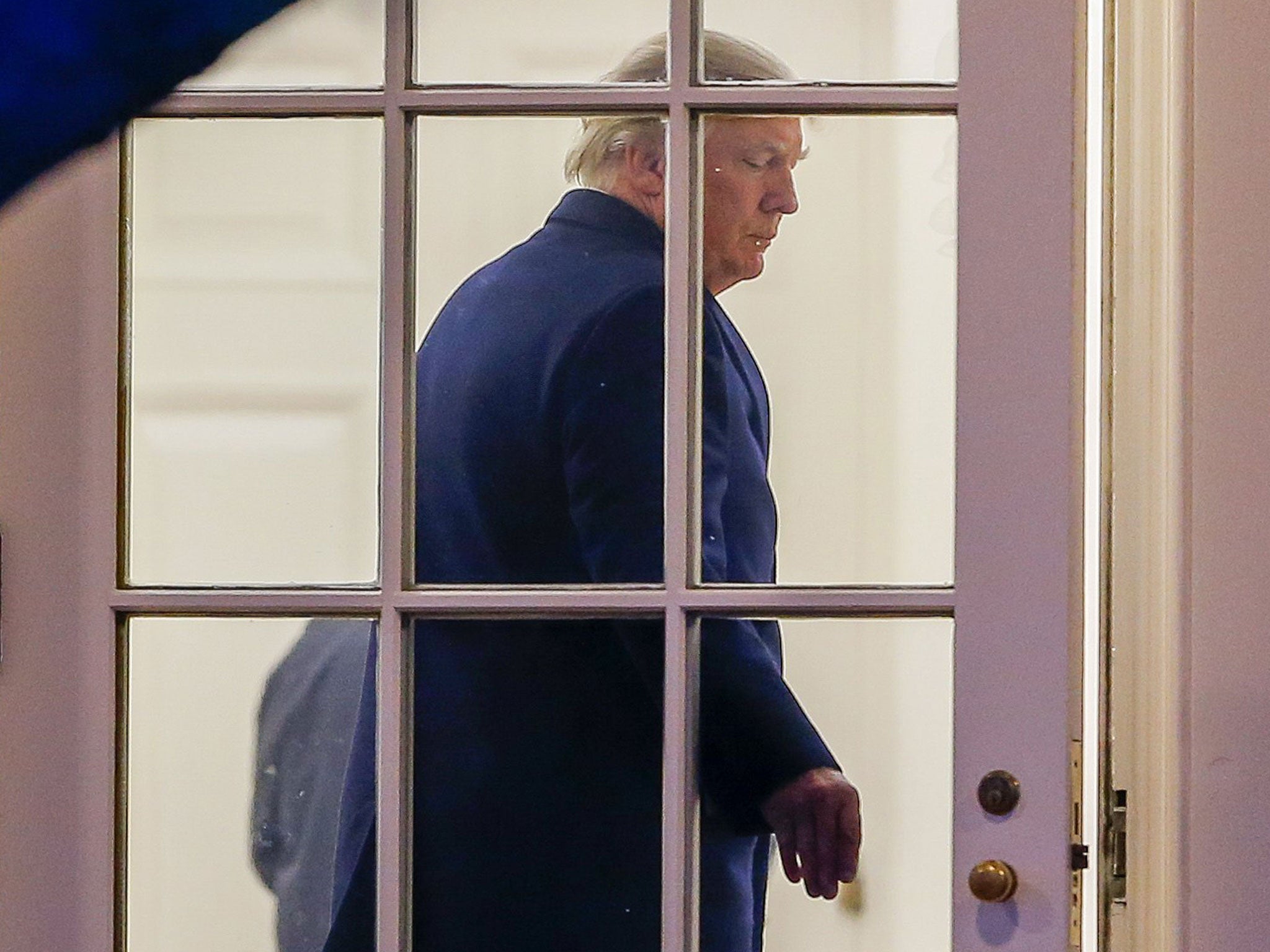 Donald Trump enters the Oval Office of the White House after arriving back on Marine One in Washington, DC from a weekend at his Mar-a-Lago club in Florida