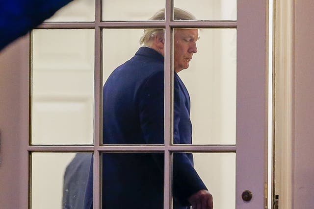 Donald Trump enters the Oval Office of the White House after arriving back on Marine One in Washington, DC from a weekend at his Mar-a-Lago club in Florida