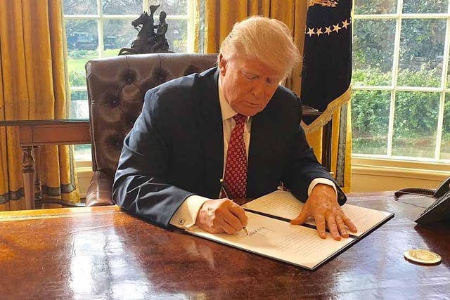 Donald Trump signed the new executive order after the first was blocked by the courts