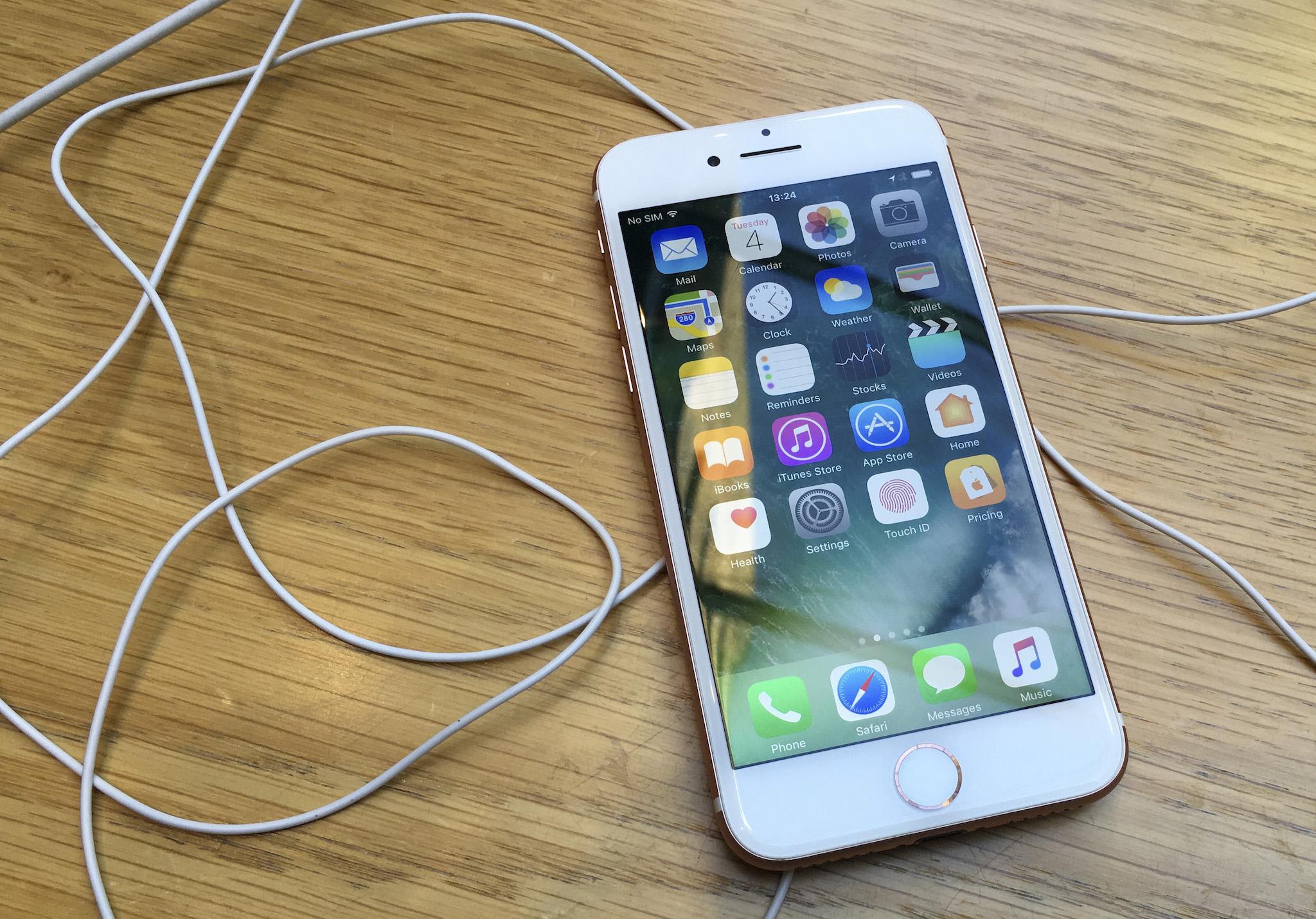 An iPhone is displayed in a store in London