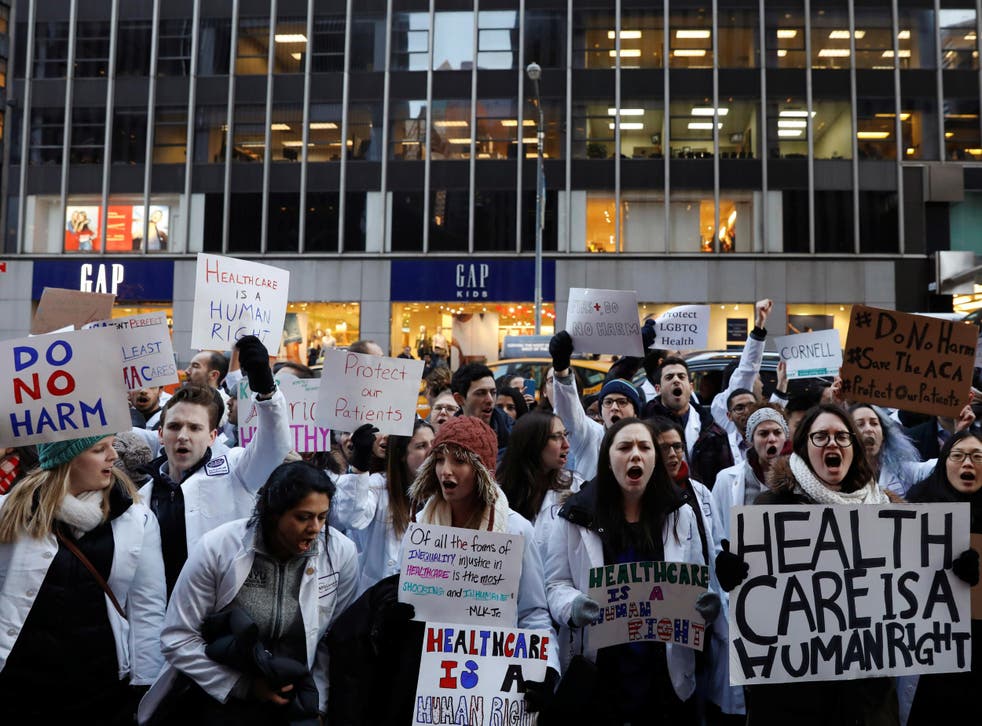 Demonstrators protest the proposed repeal of the Affordable Care Act in New York on 30 January