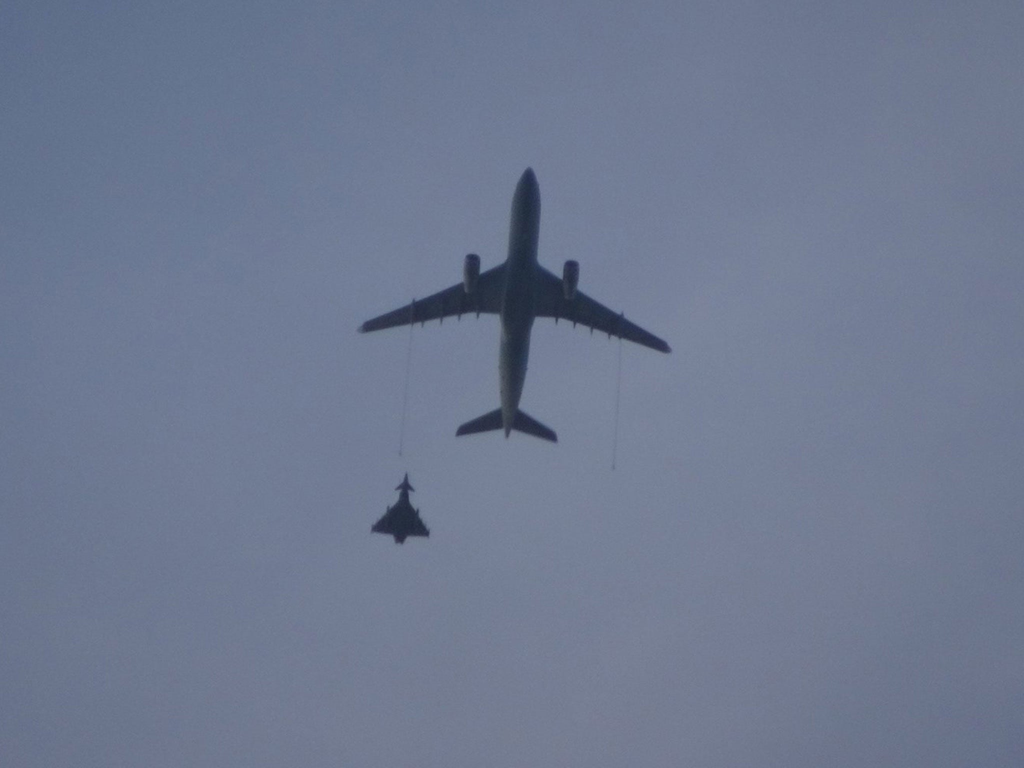 An RAF Voyager refuelling aircraft and Typhoon jet during an operation to intercept a civilian plane on 7 March