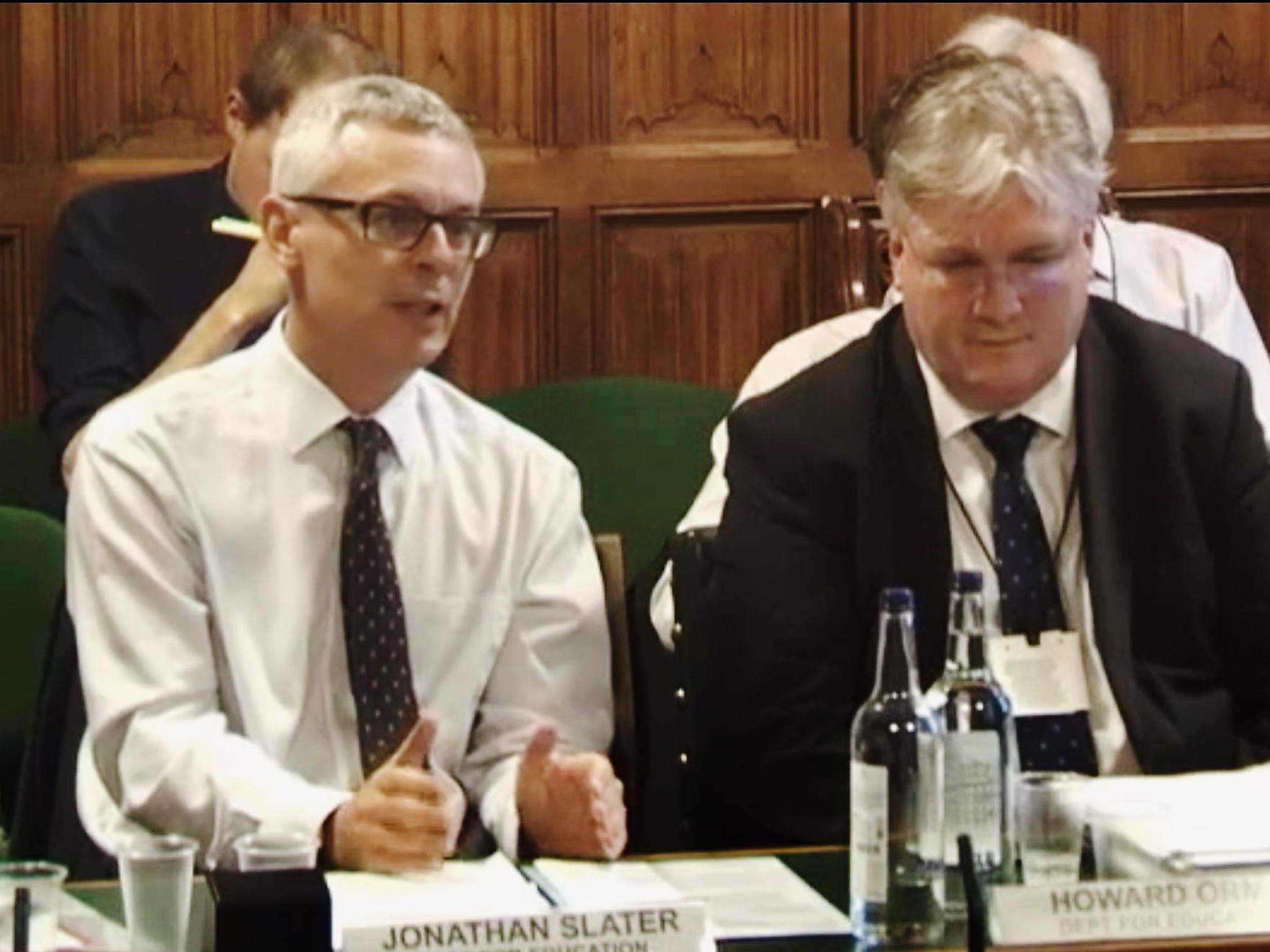 Jonathan Slater, left, speaks to MPs in 2017