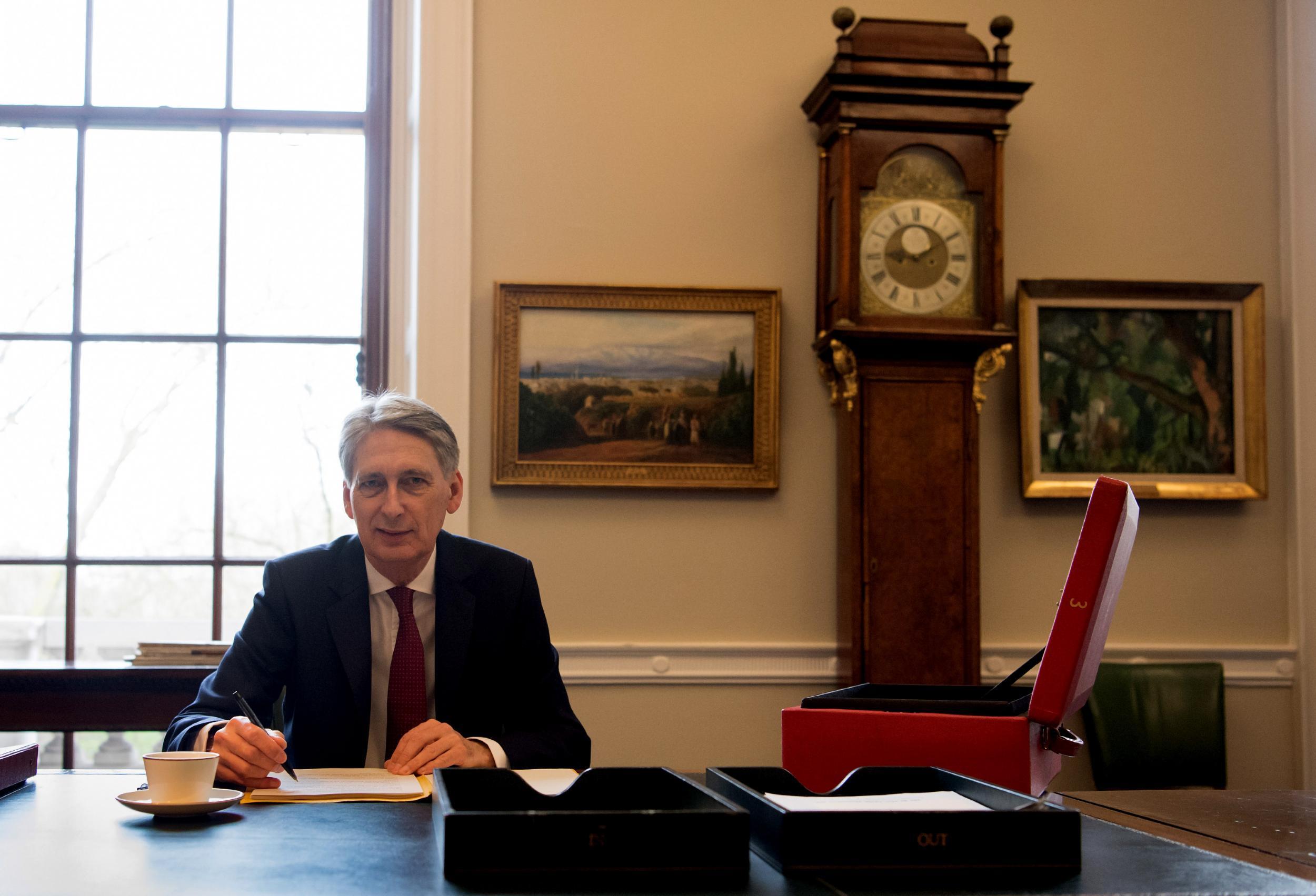 Philip Hammond prepares his speech in his office at the Treasury ahead of his 2017 budget announcement