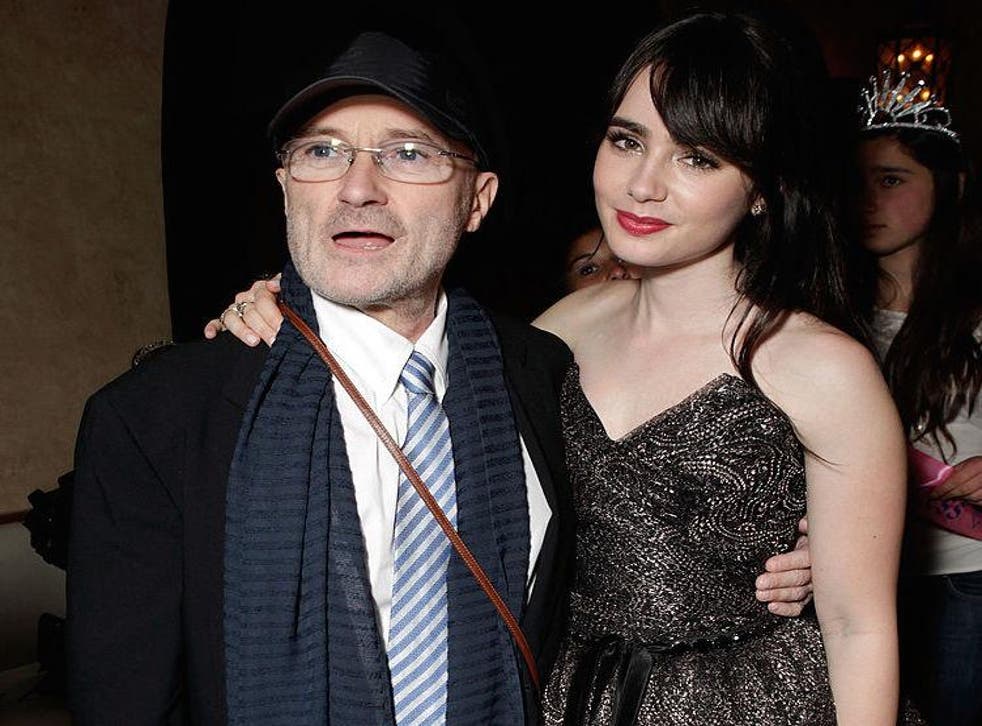 Phil Collins with his daughter, actress Lily Collins, at a party for the film Mirror Mirror in Los Angeles