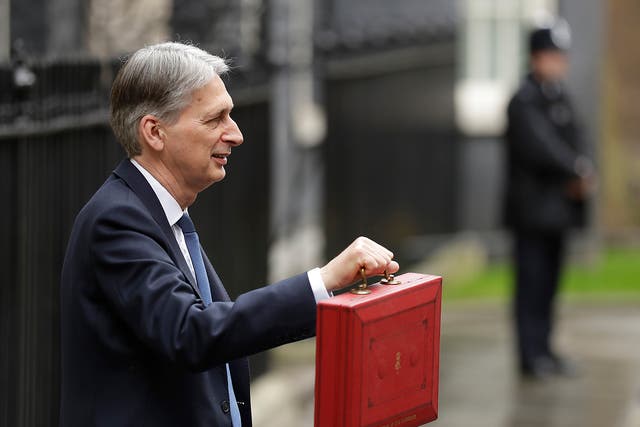 Chancellor Philip Hammond holds the red dispatch box on budget day