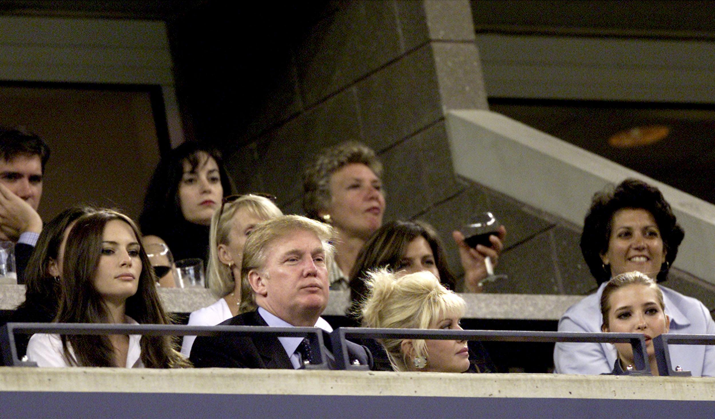 Donald Trump watches Venus and Serena Williams compete during the women's final match of the US Open with his girlfriend Melania Knauss, his ex-wife Ivana Trump and Ivanka in 2001.