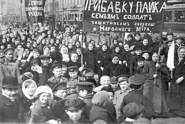 Mostly female workers marching in St Petersburg demanding the government 'feed the children of the defenders of the motherland'