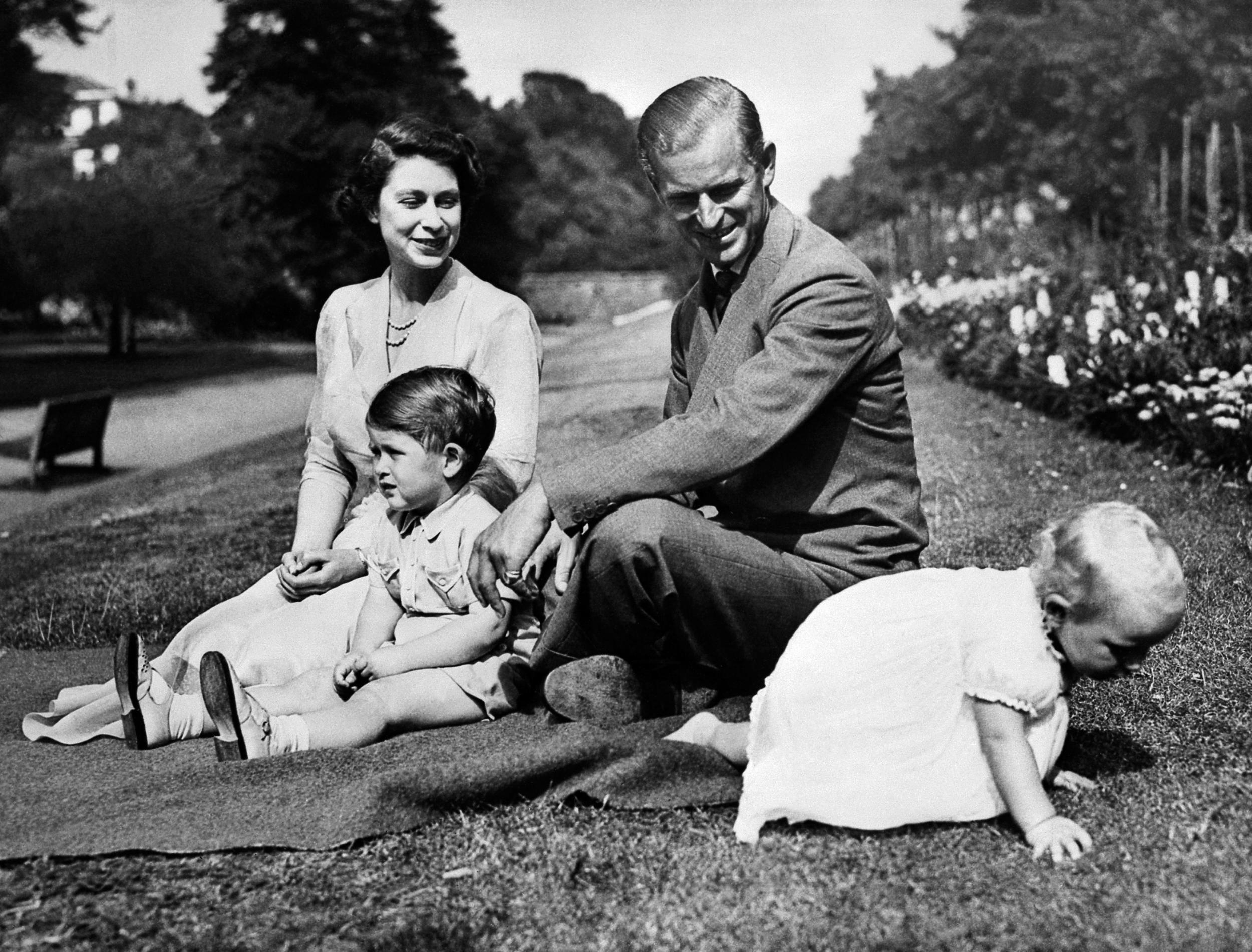 Queen Elizabeth II with her husband Prince Philip and their children Charles and Anne