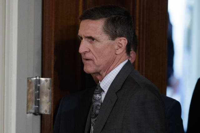 Mike Flynn arrives for a news conference in the East Room of the White House in Washington