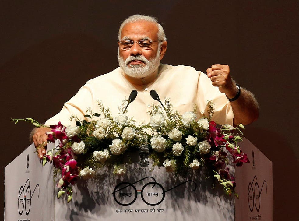India's Prime Minister Narendra Modi addresses the audience during an event to honour "sarpanch" women